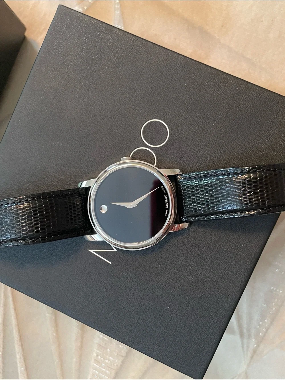 Movado Black Dial Silver Case Black Leather Strap Watch